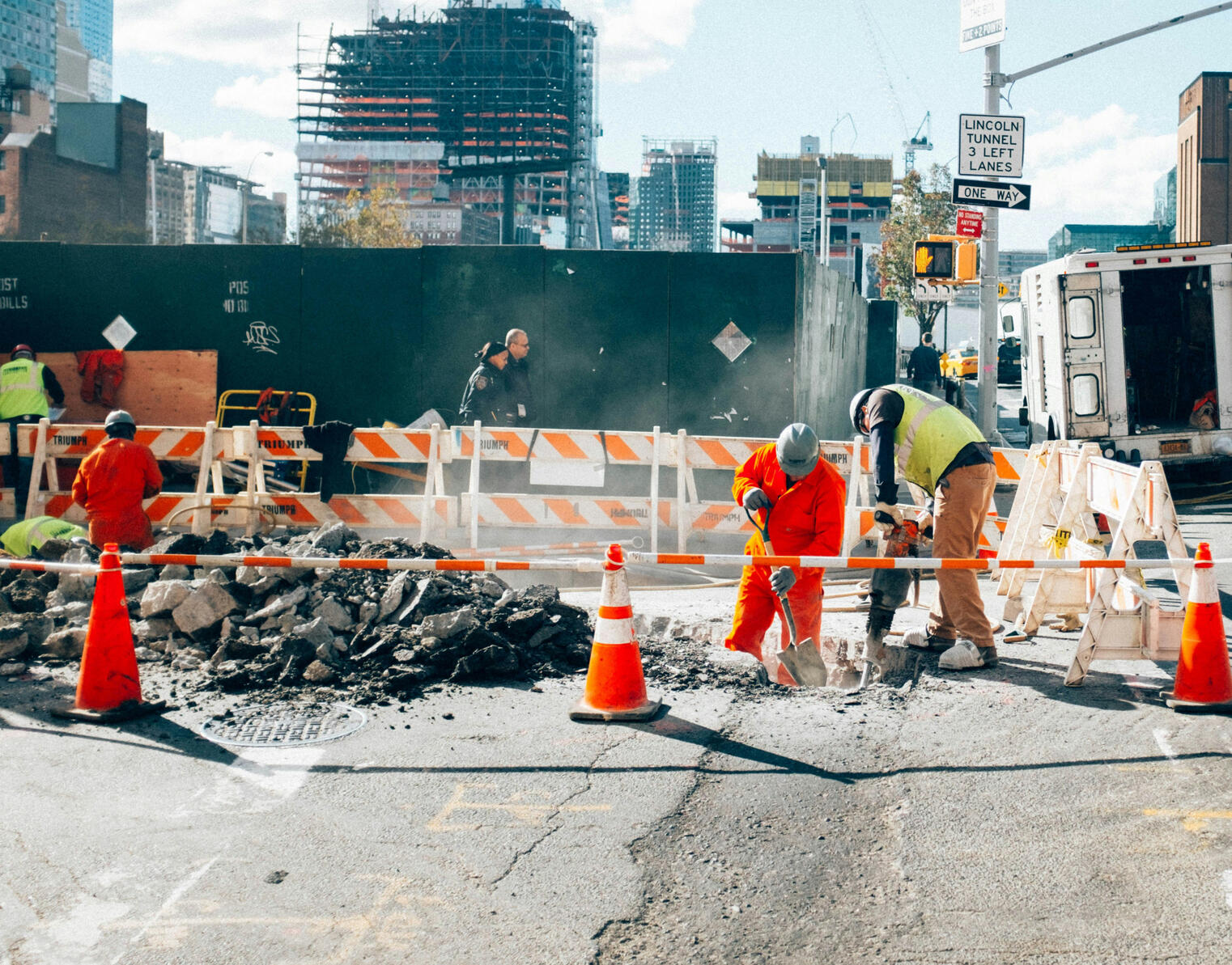 Example image of a public works crew repairing a street.